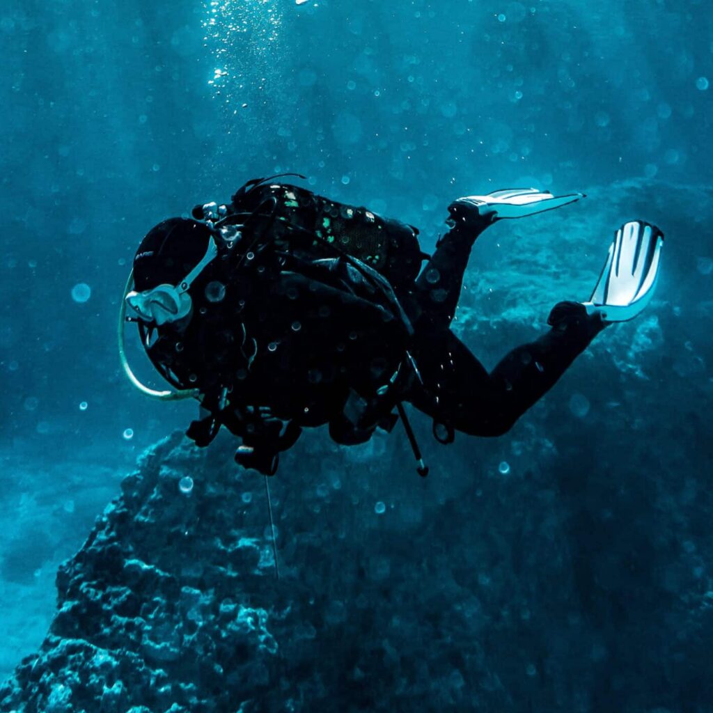 scuba diver navigating the deep blue with our lessons on VUCA leadership.